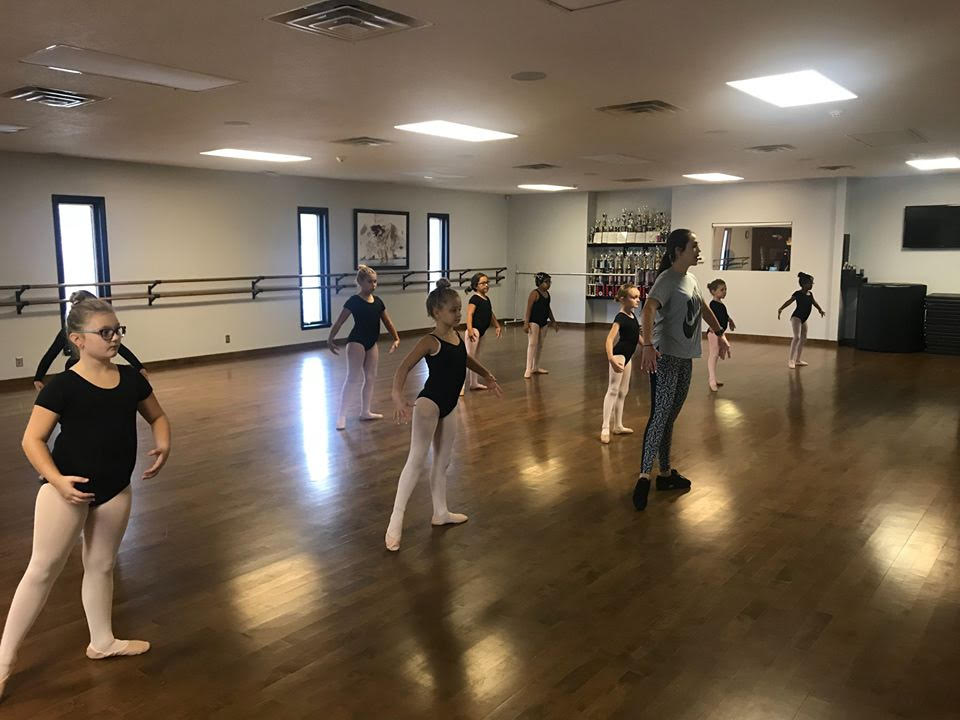 Kids following the dance instructor